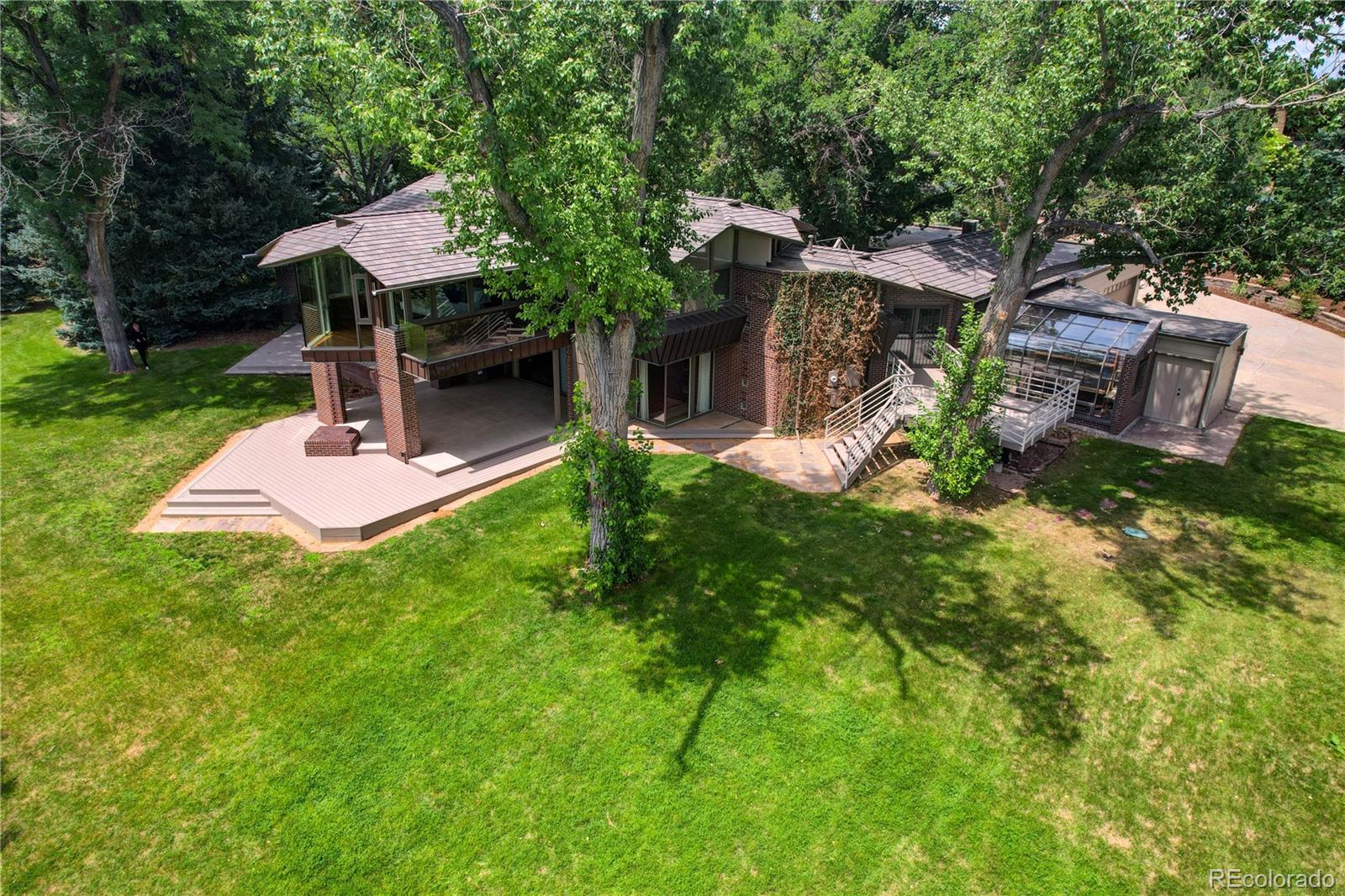 5140 Juniper Street Bow Mar, CO 80123 - Photo 37 of 40 a front view of a house with a yard