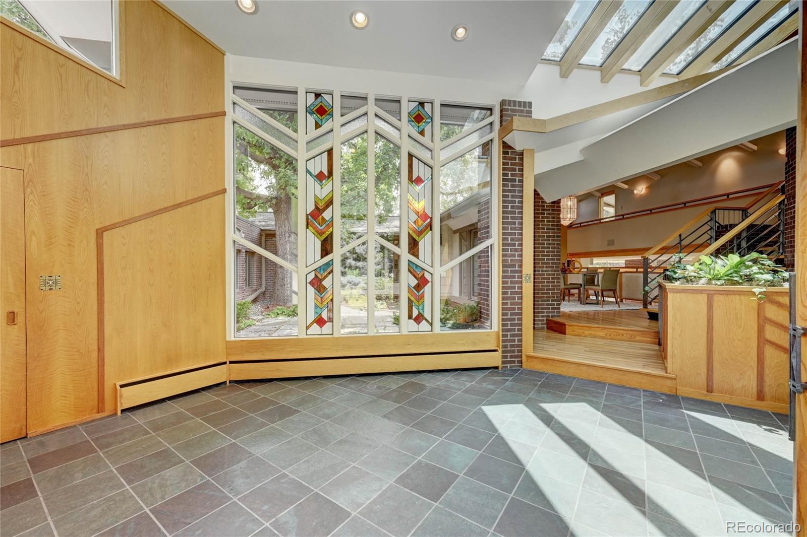 5140 Juniper Street Bow Mar, CO 80123 - Photo 5 of 40 a view of a garage with wooden door