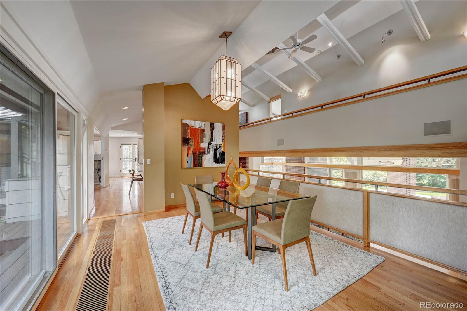 5140 Juniper Street Bow Mar, CO 80123 - Photo 7 of 40 a view of a dining room with furniture window and wooden floor