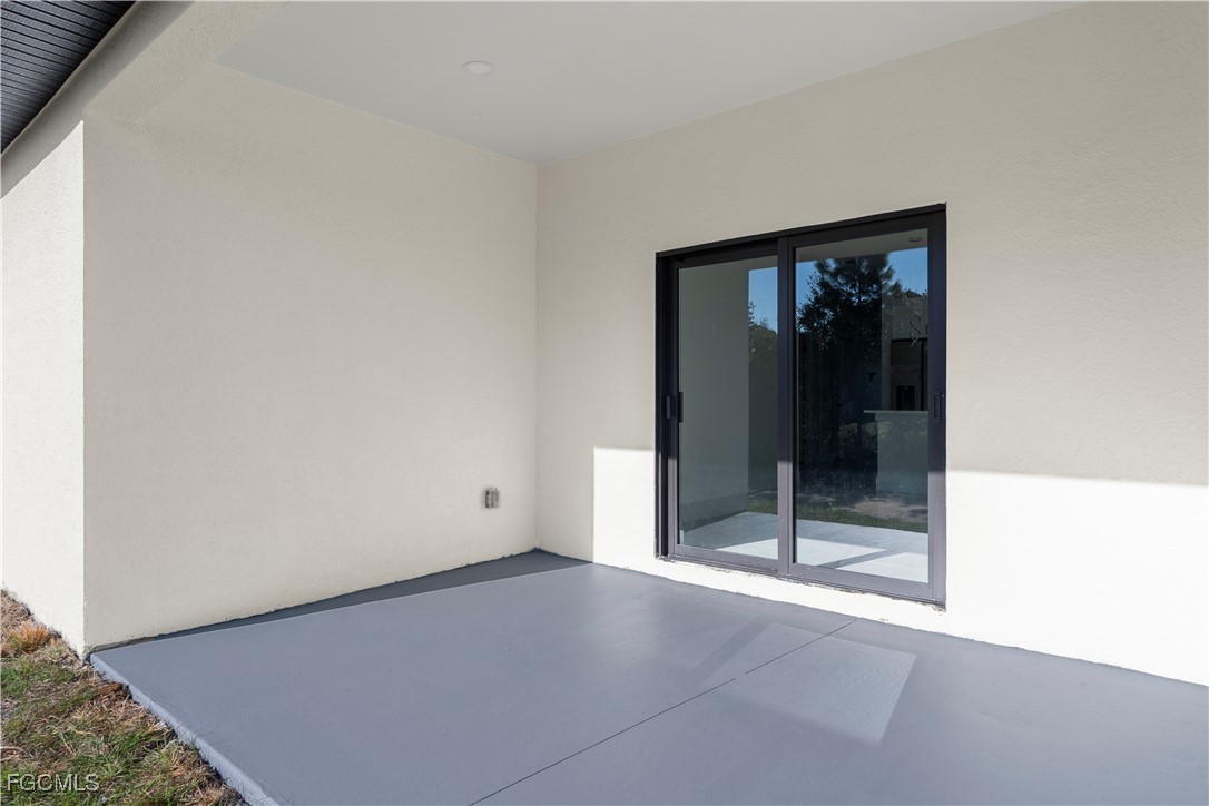 4649-4651 24th Street Southwest Lehigh Acres, FL 33973 - Photo 29 of 29 a view of empty room with wooden floor