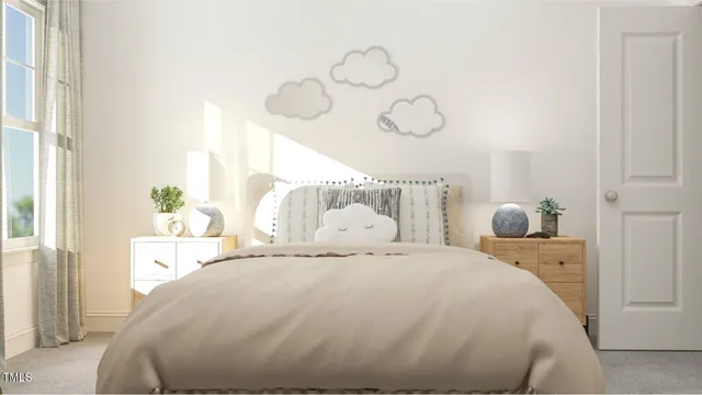 a bedroom with a bed and window