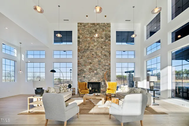 a living room with fireplace furniture and a flat screen tv