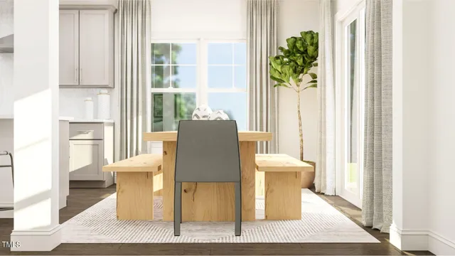 a living room with a couch and a dining table