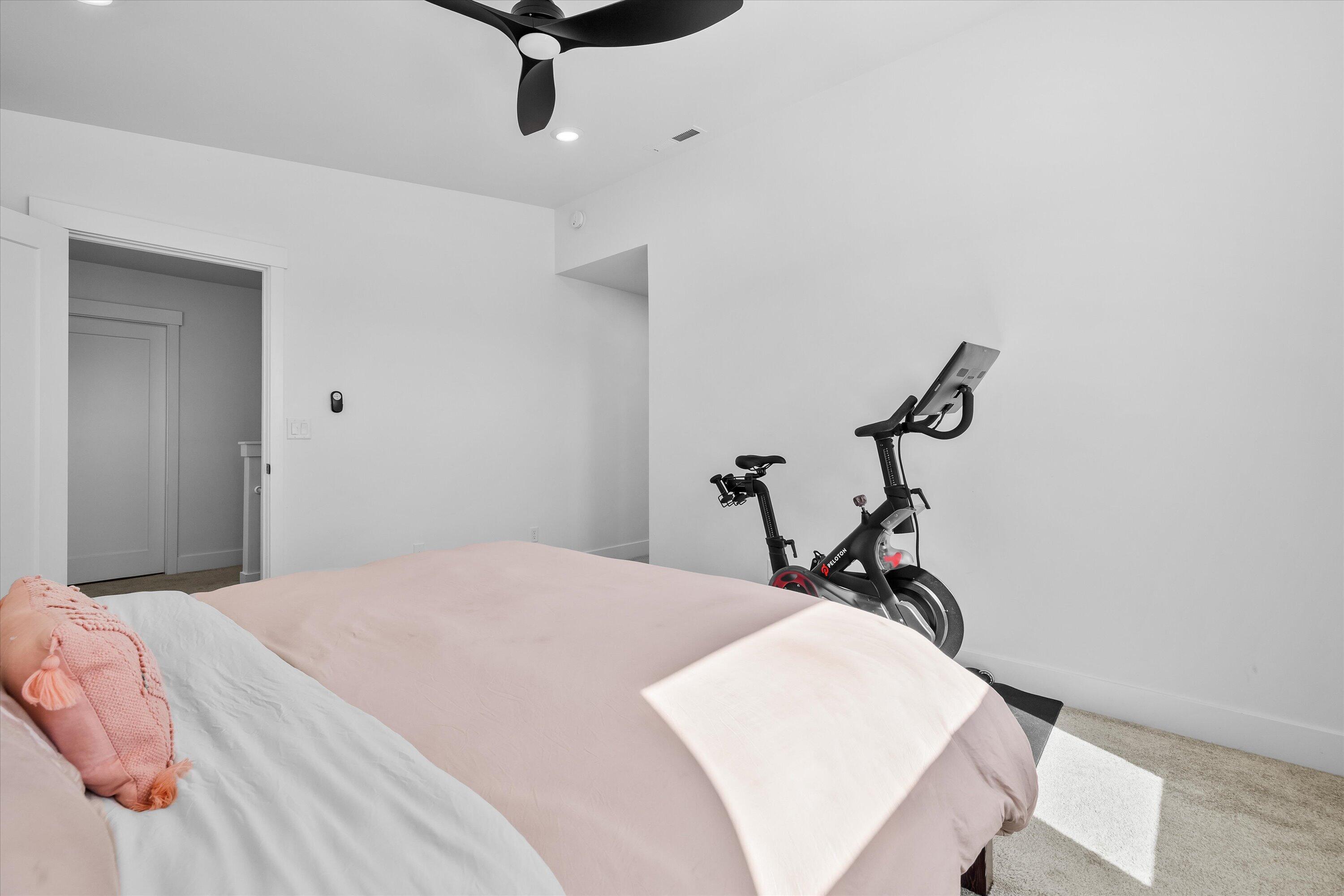 60903 Southeast Epic Place Bend, OR 97702 - Photo 24 of 48 a bedroom with a bed and a chandelier fan
