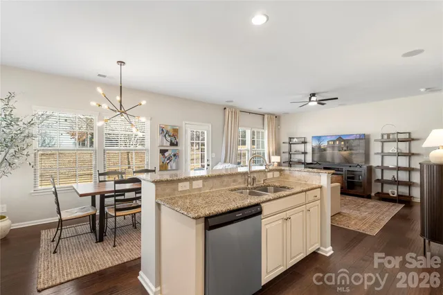 a kitchen with center island and stainless steel appliances