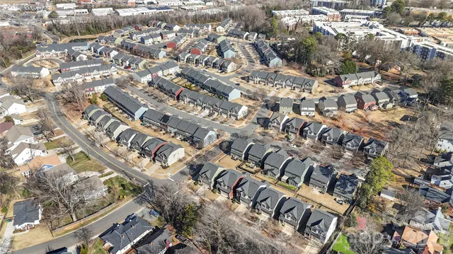 a view of a wooden door in front of a house