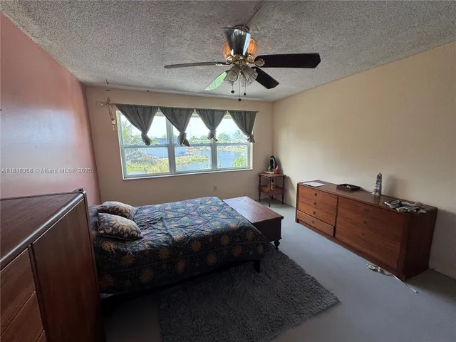 a bed room with a bed and a window