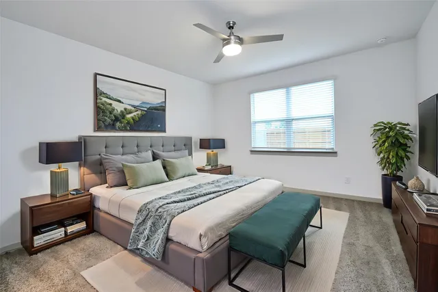 a bedroom with bed and a window