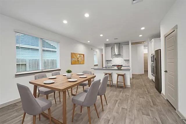 a kitchen with a table and chairs in it