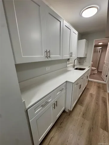 a spacious bathroom with a double vanity sink and mirror