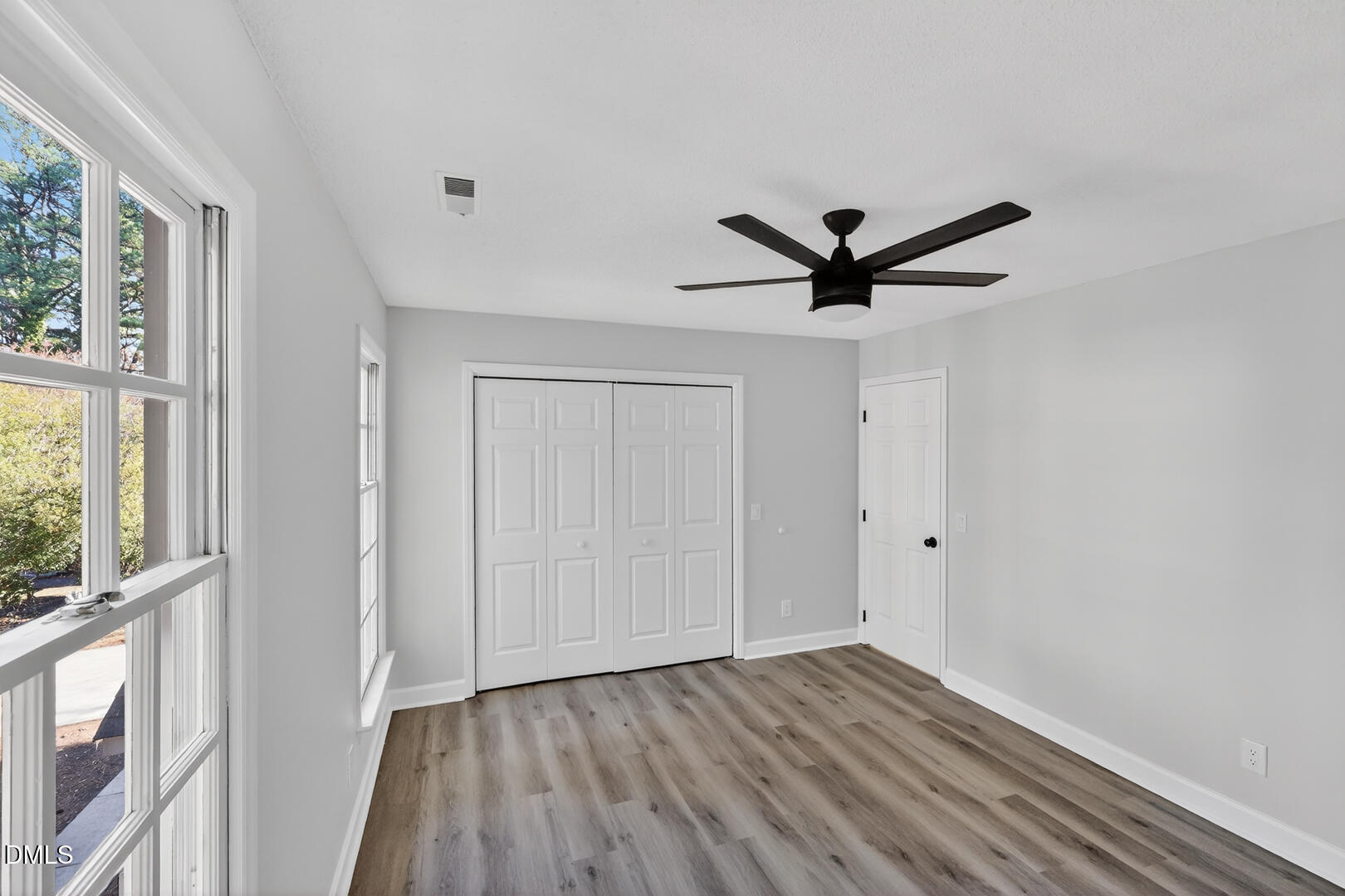 2224 Effingham Circle Raleigh, NC 27615 - Photo 28 of 51 a view of a livingroom with a hardwood floor and a ceiling fan
