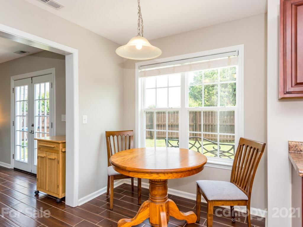 20 Roanoke Road Fletcher, NC 28732 - Photo 11 of 36 a view of a dining room with furniture window and wooden floor