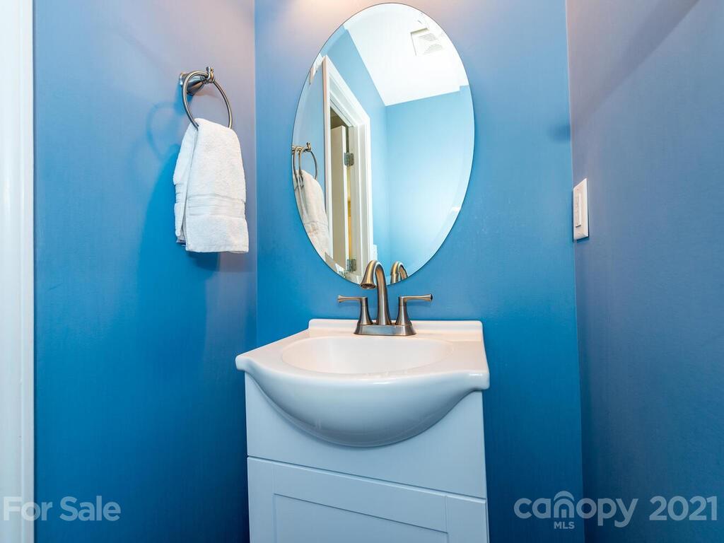 20 Roanoke Road Fletcher, NC 28732 - Photo 13 of 36 a bathroom with a sink and mirror