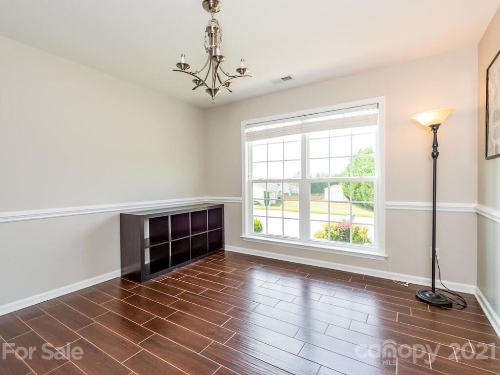20 Roanoke Road Fletcher, NC 28732 - Photo 15 of 36 a view of an empty room with wooden floor and a window