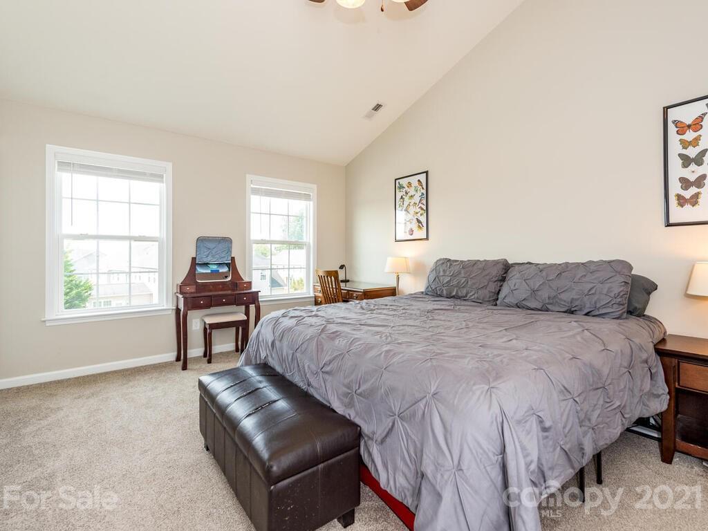 20 Roanoke Road Fletcher, NC 28732 - Photo 17 of 36 a spacious bedroom with a bed and a window