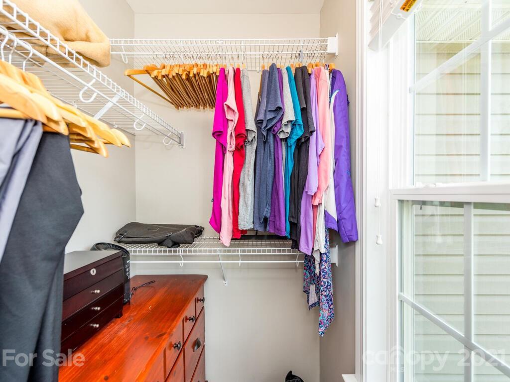 20 Roanoke Road Fletcher, NC 28732 - Photo 20 of 36 a view of walk in closet with clothes