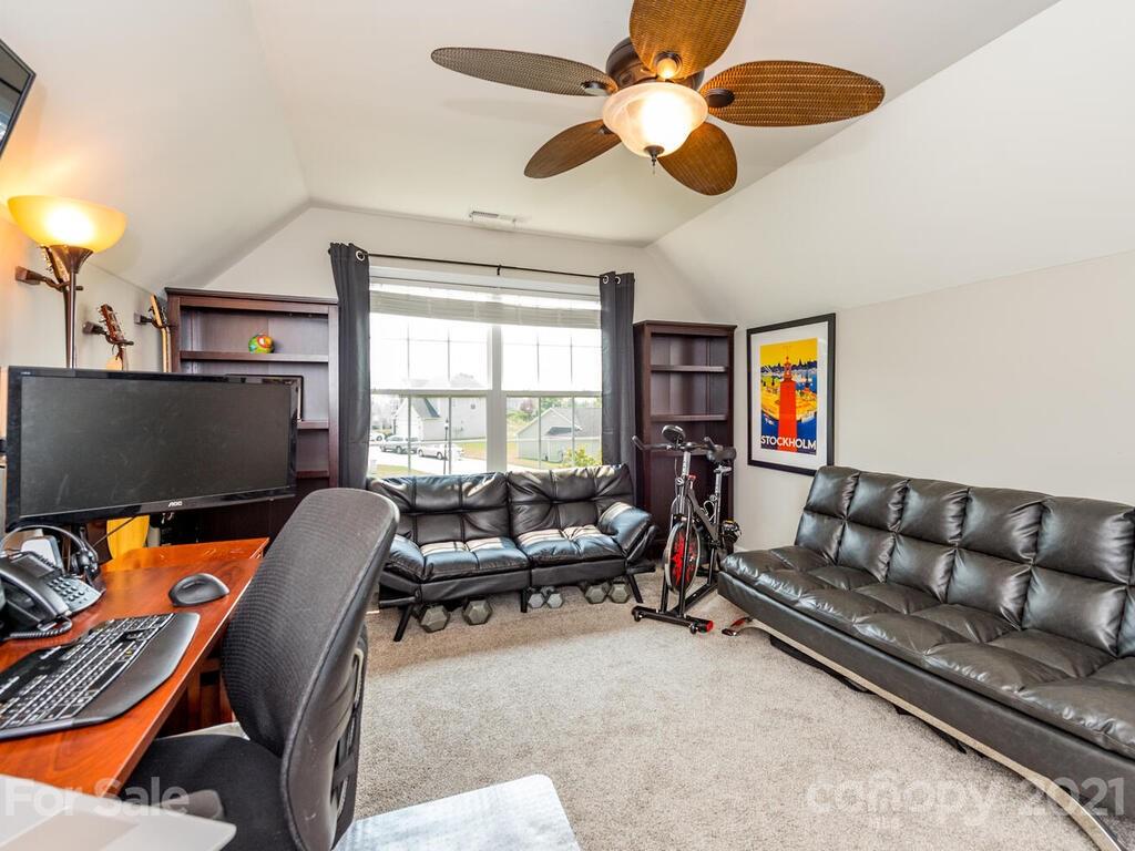 20 Roanoke Road Fletcher, NC 28732 - Photo 26 of 36 a living room with furniture ceiling fan and a window