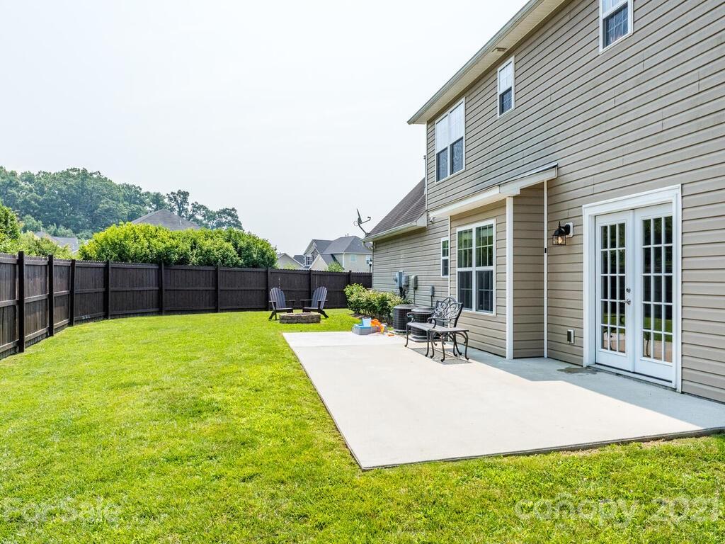 20 Roanoke Road Fletcher, NC 28732 - Photo 33 of 36 a view of a patio with a table and chairs