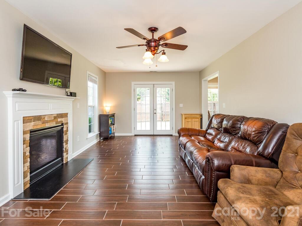 20 Roanoke Road Fletcher, NC 28732 - Photo 5 of 36 a living room with furniture fireplace and flat screen tv