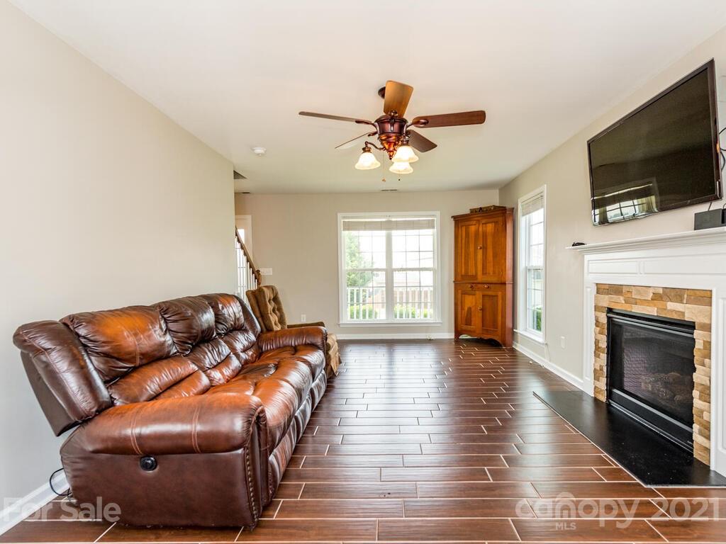 20 Roanoke Road Fletcher, NC 28732 - Photo 6 of 36 a living room with furniture fireplace and flat screen tv