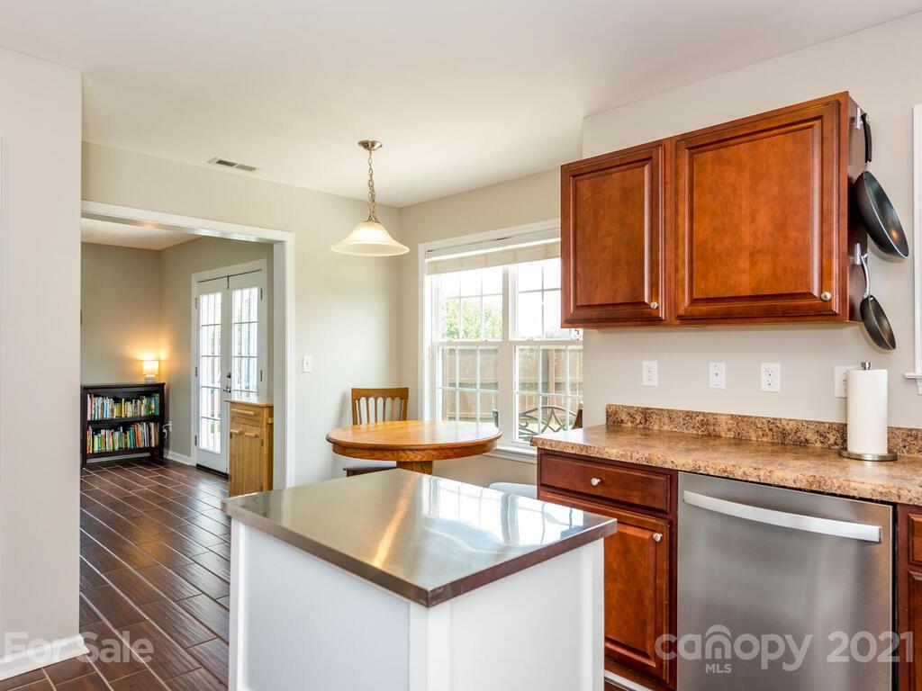 20 Roanoke Road Fletcher, NC 28732 - Photo 10 of 36 a kitchen with stainless steel appliances granite countertop a sink stove and cabinets