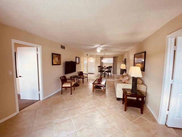 9420 South Hollybrook Lake Drive, Unit 305 Pembroke Pines, FL 33025 - Photo 8 of 16 a living room with furniture and a flat screen tv