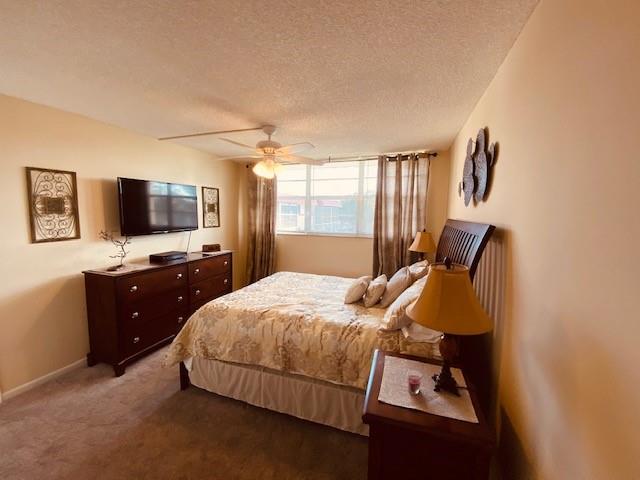 9420 South Hollybrook Lake Drive, Unit 305 Pembroke Pines, FL 33025 - Photo 9 of 16 a bedroom with a bed and a flat screen tv