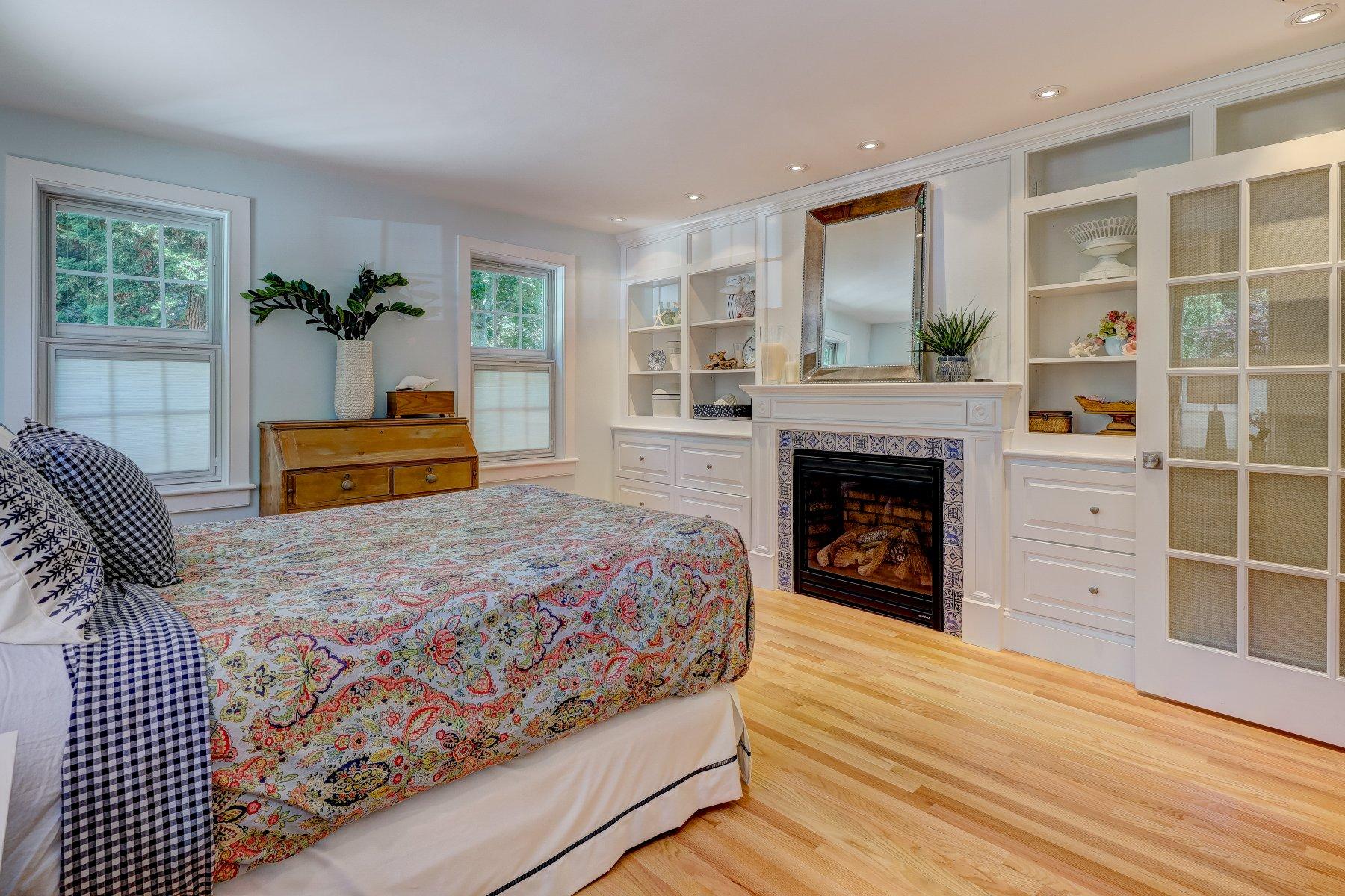 646 South Orleans Road Orleans, MA 02653 - Photo 19 of 43 a bedroom with a bed and a fireplace