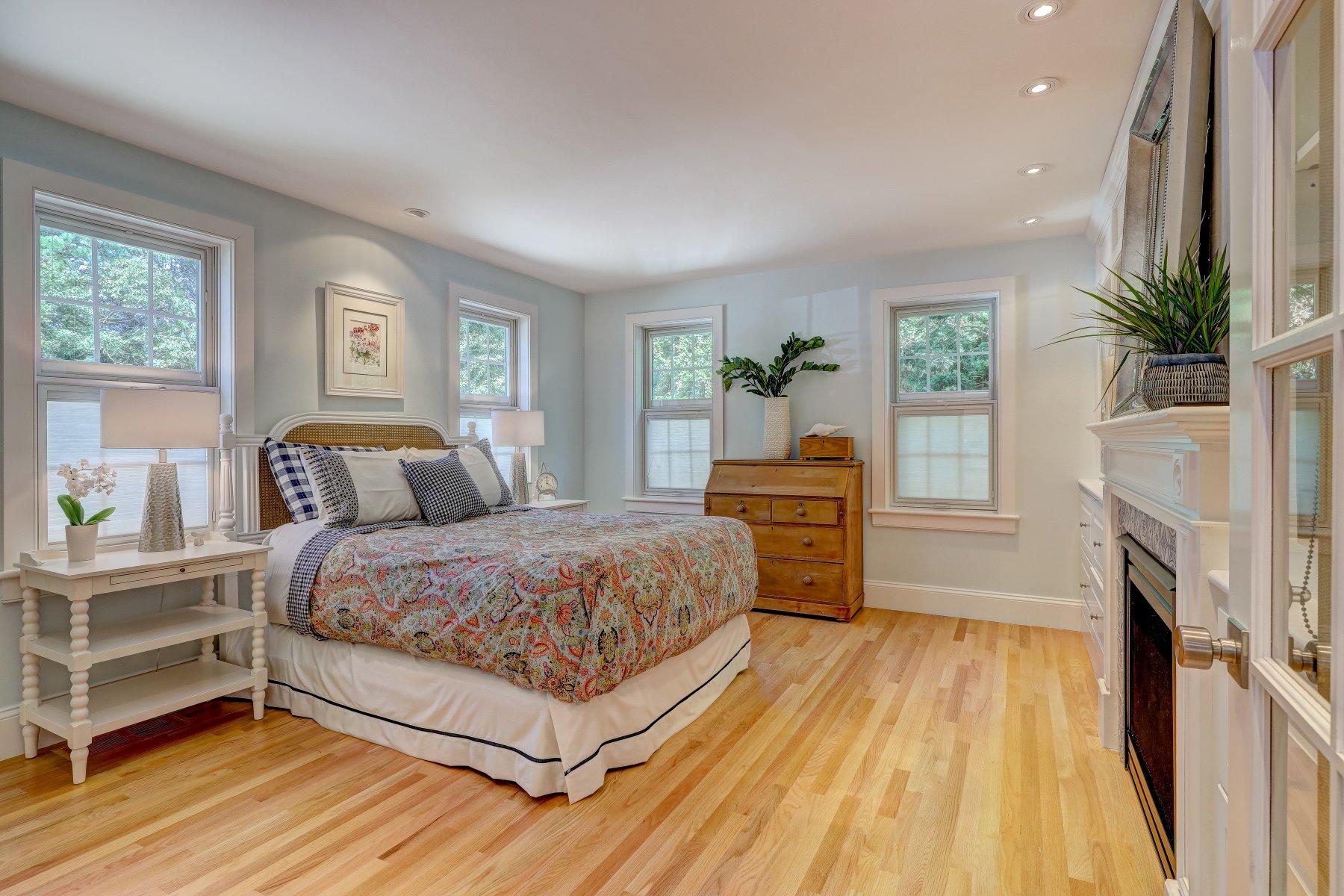 646 South Orleans Road Orleans, MA 02653 - Photo 20 of 43 a bedroom with a bed and a fireplace