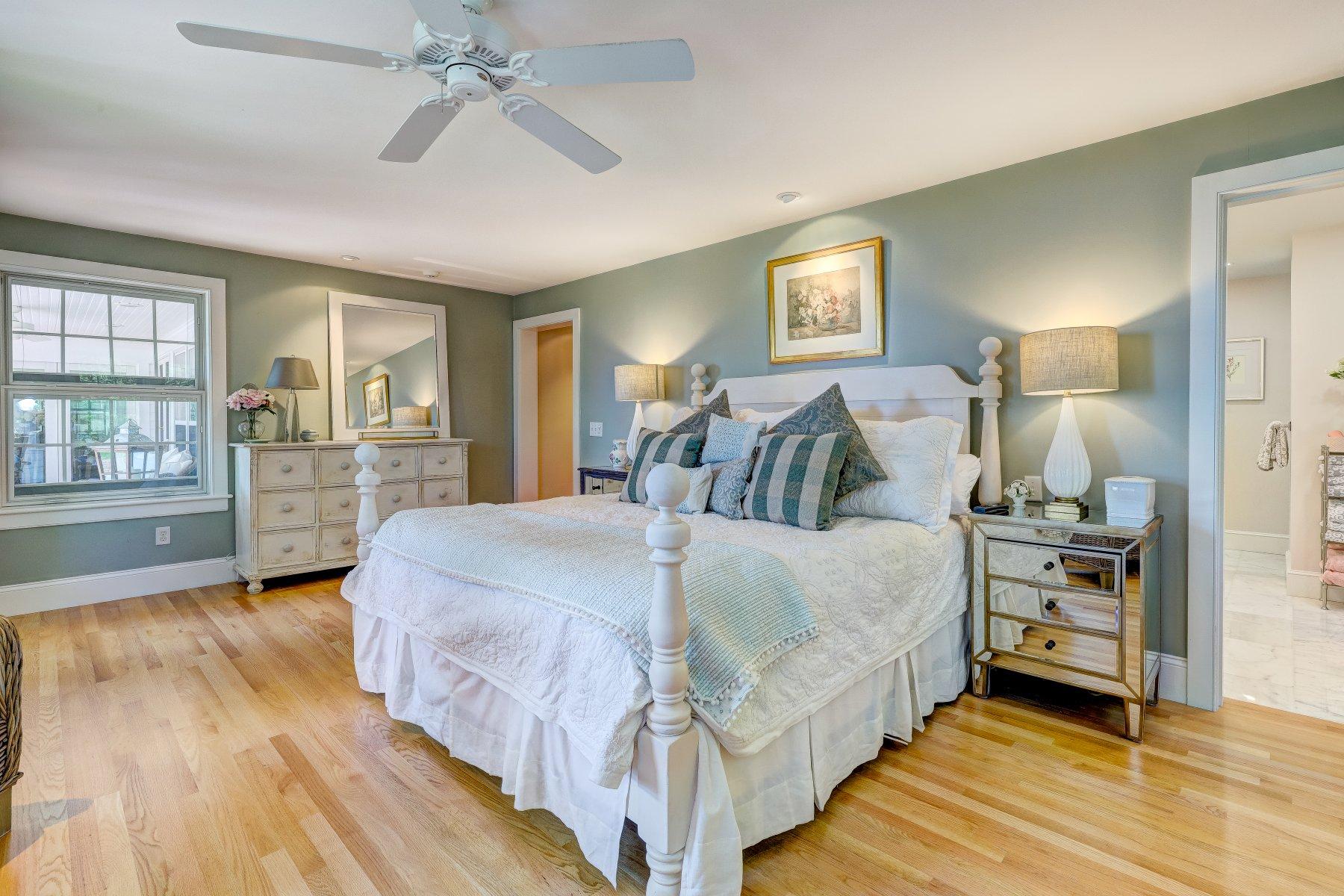 646 South Orleans Road Orleans, MA 02653 - Photo 21 of 43 a spacious bedroom with a bed and window