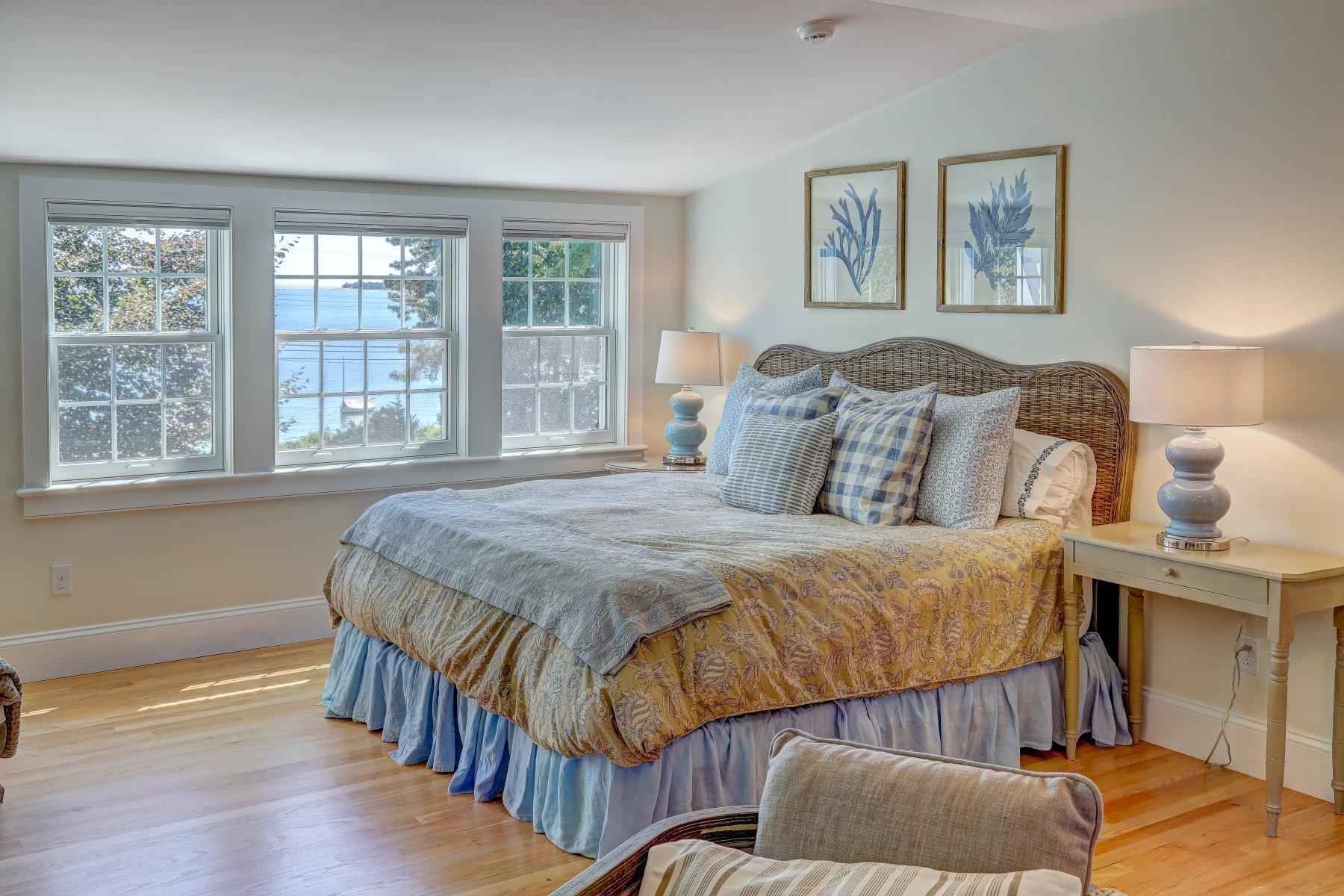 646 South Orleans Road Orleans, MA 02653 - Photo 26 of 43 a bedroom with a bed and wooden floor