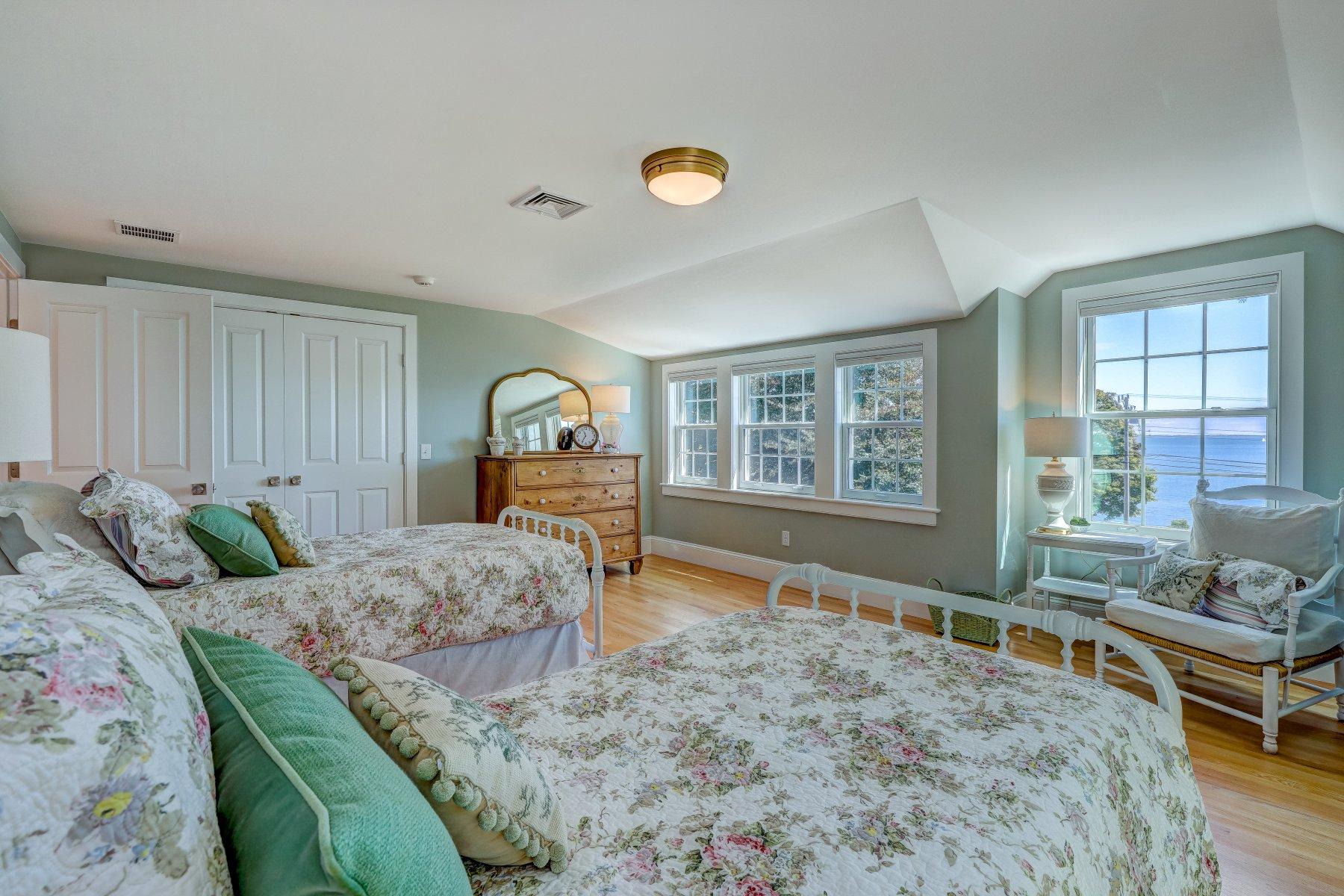 646 South Orleans Road Orleans, MA 02653 - Photo 29 of 43 a bedroom with a bed and dresser with wooden floor
