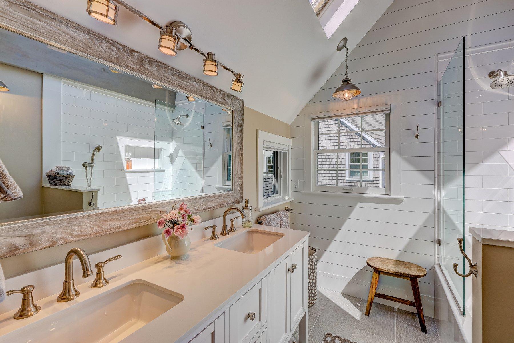 646 South Orleans Road Orleans, MA 02653 - Photo 32 of 43 a bathroom with a sink double vanity and a mirror