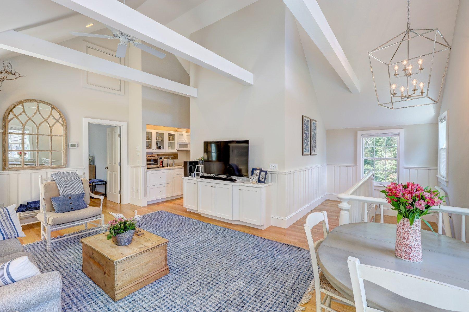 646 South Orleans Road Orleans, MA 02653 - Photo 34 of 43 a living room with furniture and a flat screen tv