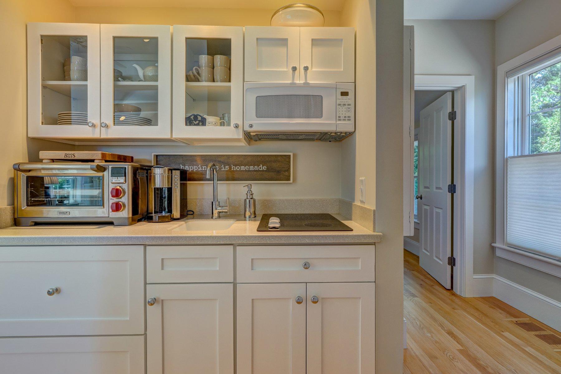 646 South Orleans Road Orleans, MA 02653 - Photo 37 of 43 a kitchen with cabinets and window