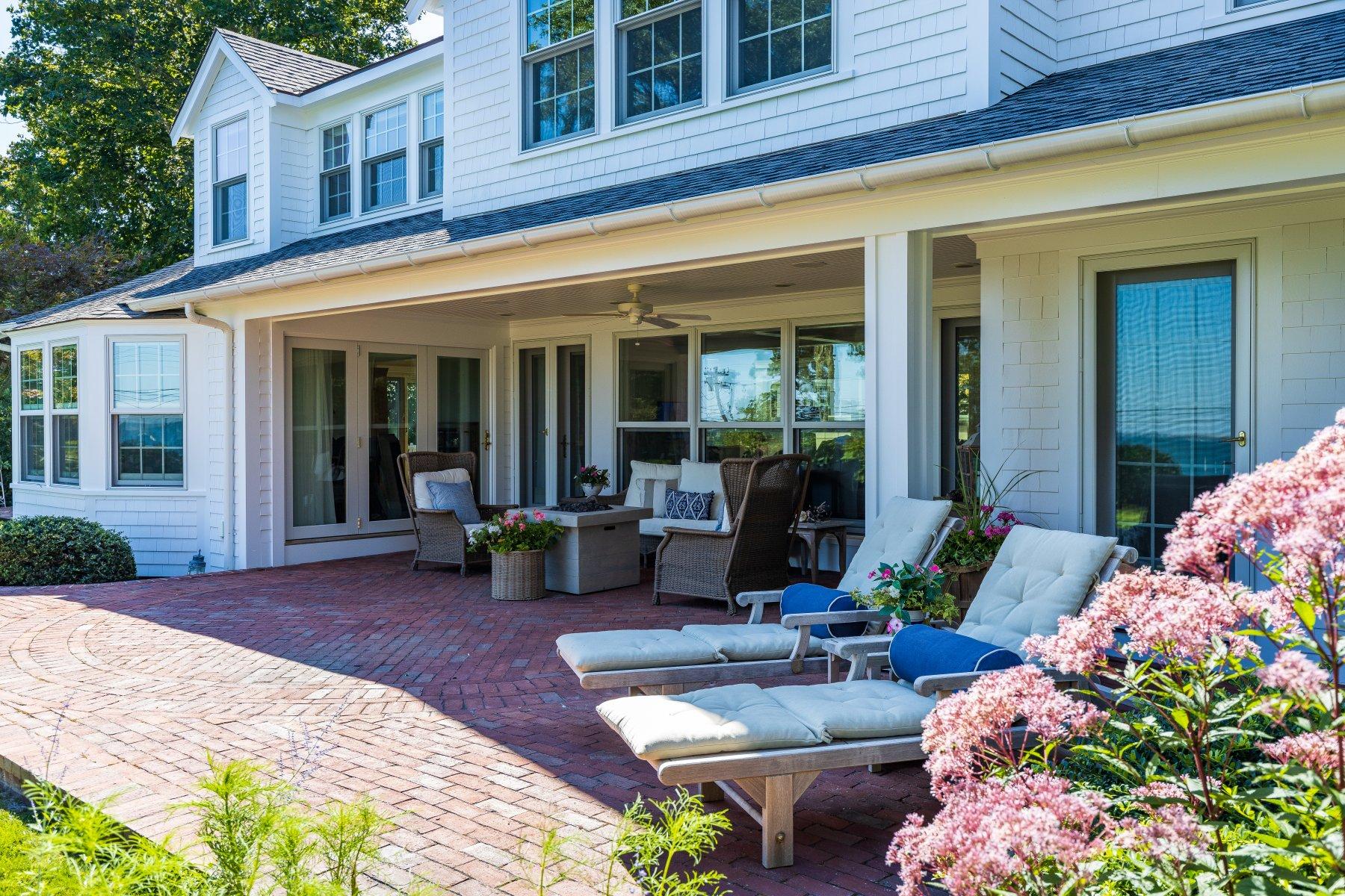 646 South Orleans Road Orleans, MA 02653 - Photo 8 of 43 a view of a patio with couches table and chairs and potted plants