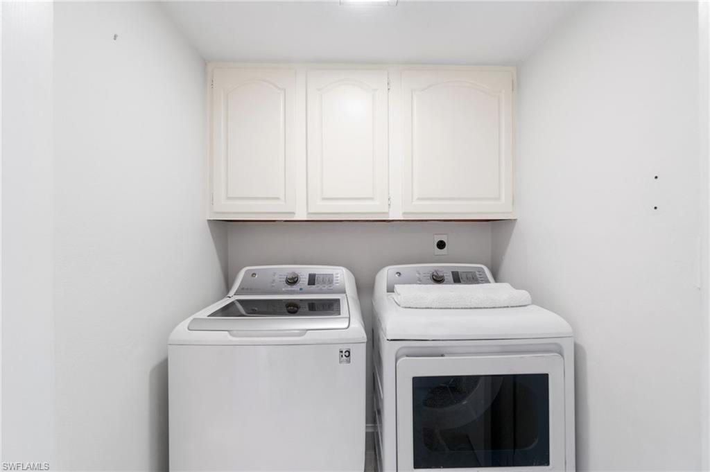 305 Goodlette-Frank Road, Unit C204 Naples, FL 34102 - Photo 13 of 16 a utility room with dryer and washer
