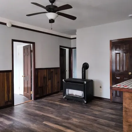 a view of an entryway with wooden floor