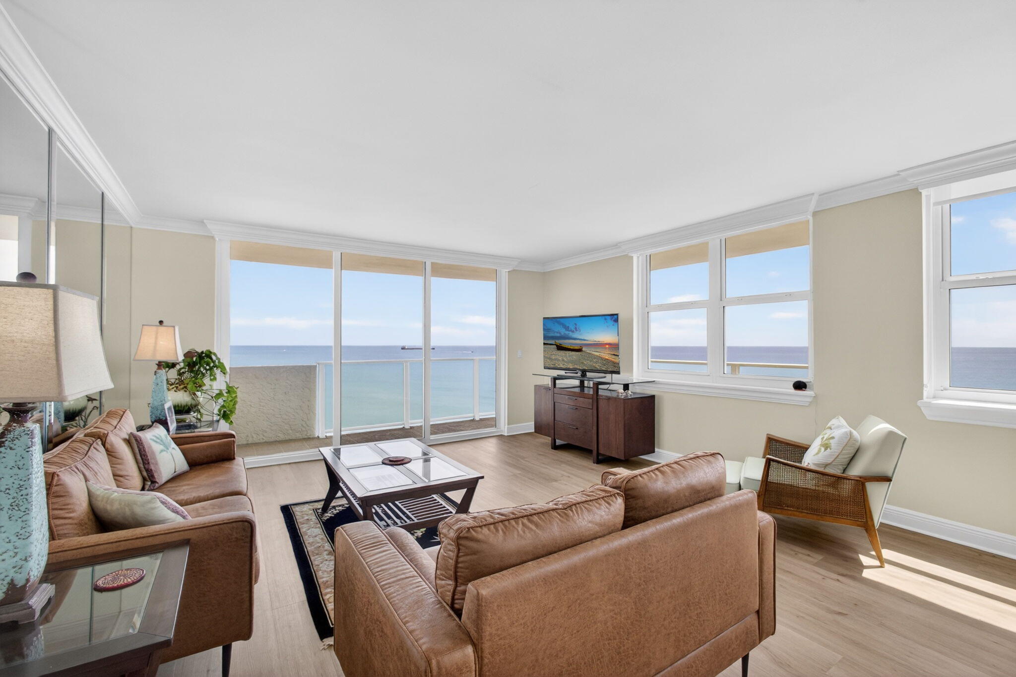 5440 North Ocean Drive, Unit 1006 Riviera Beach, FL 33404 - Photo 16 of 57 a living room with furniture and a large window