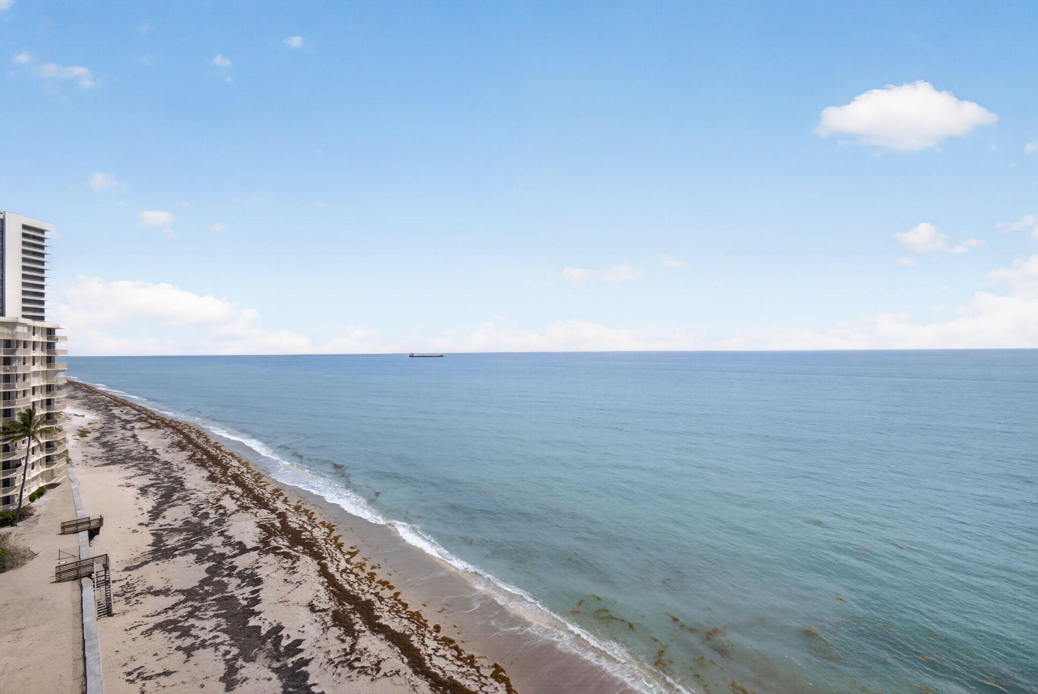 5440 North Ocean Drive, Unit 1006 Riviera Beach, FL 33404 - Photo 22 of 57 a view of beach and an ocean