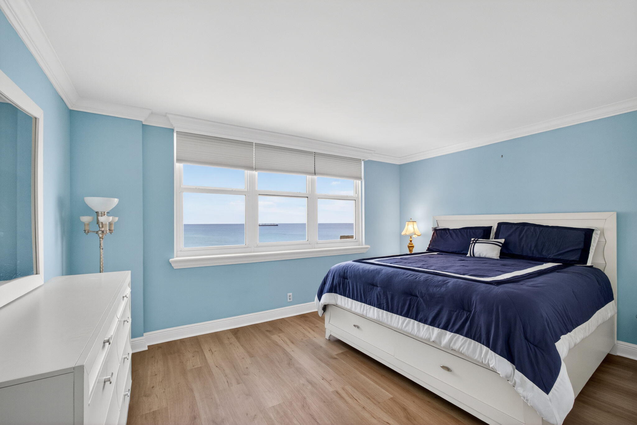 5440 North Ocean Drive, Unit 1006 Riviera Beach, FL 33404 - Photo 27 of 57 a bedroom with a bed and a window