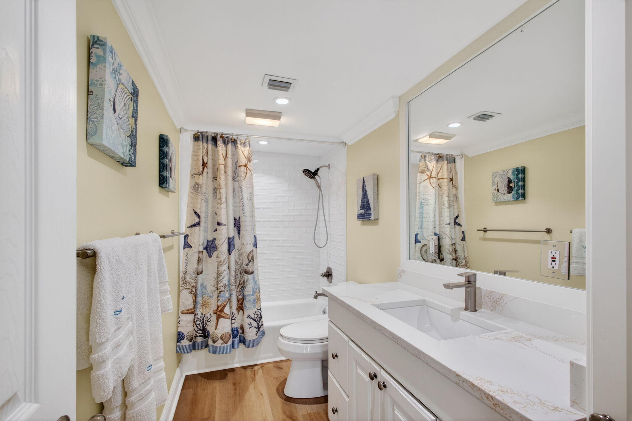 5440 North Ocean Drive, Unit 1006 Riviera Beach, FL 33404 - Photo 28 of 57 a bathroom with a granite countertop sink a toilet and shower