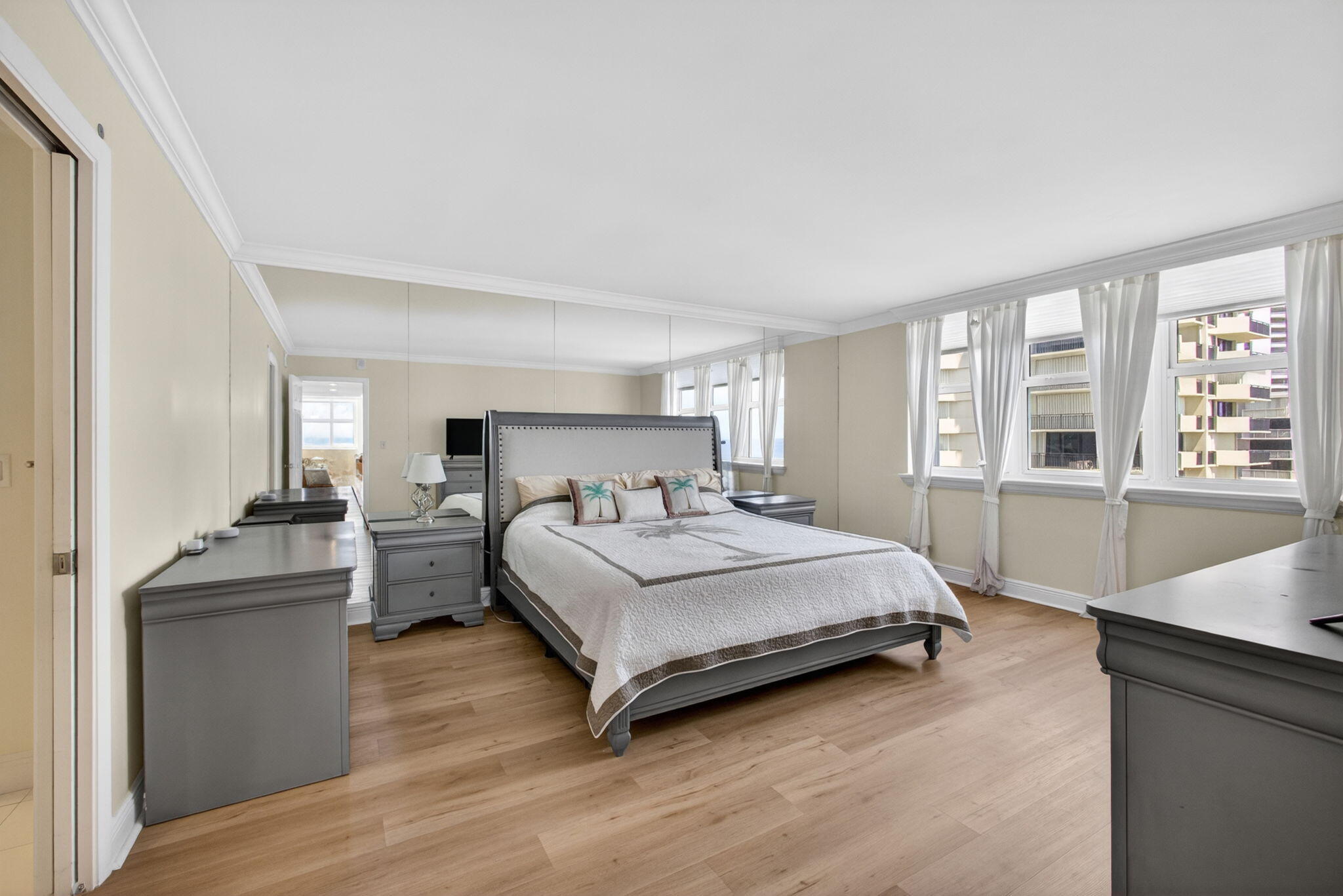 5440 North Ocean Drive, Unit 1006 Riviera Beach, FL 33404 - Photo 30 of 57 a bedroom with a bed and a large window