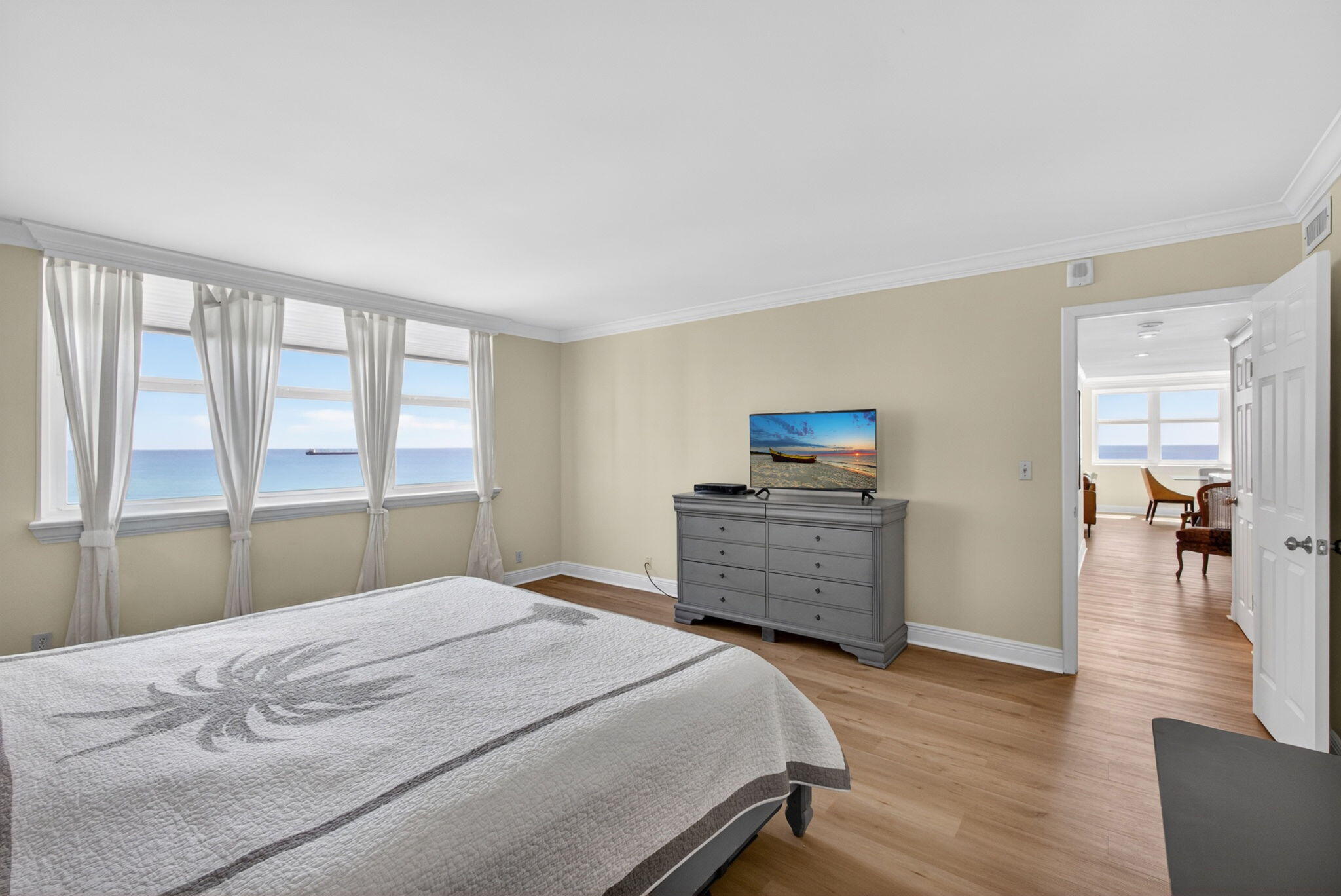 5440 North Ocean Drive, Unit 1006 Riviera Beach, FL 33404 - Photo 31 of 57 a bedroom with a bed and a television