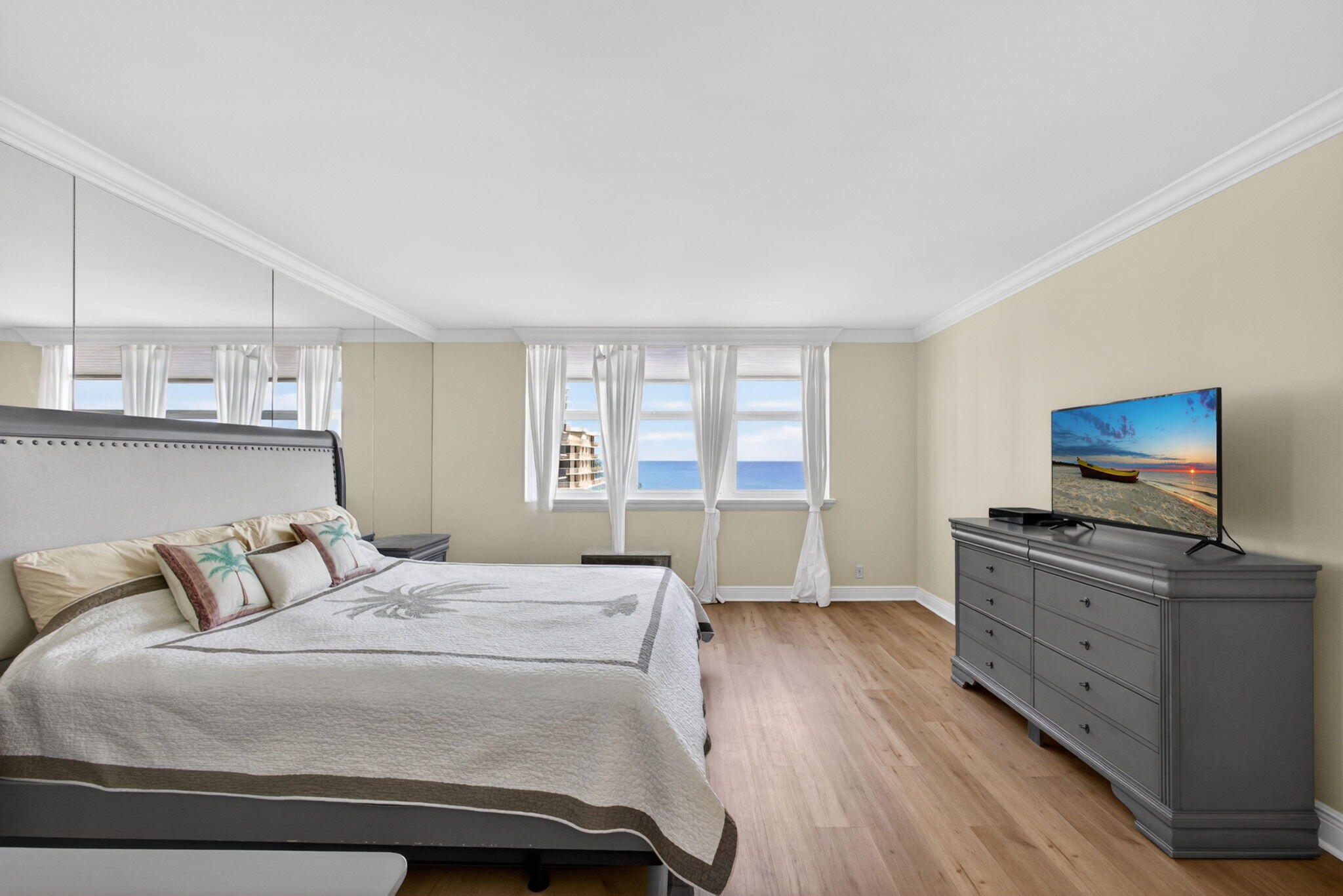5440 North Ocean Drive, Unit 1006 Riviera Beach, FL 33404 - Photo 32 of 57 a bedroom with a bed and a flat screen tv