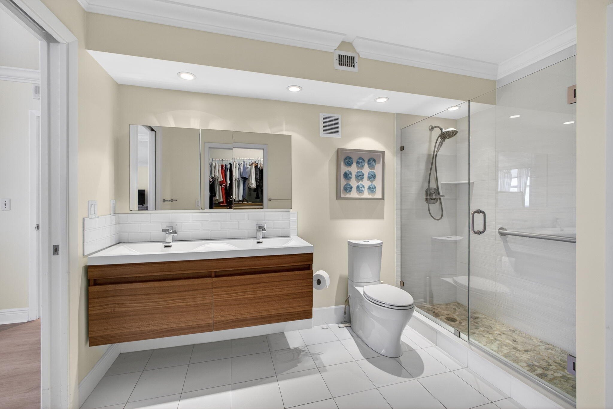 5440 North Ocean Drive, Unit 1006 Riviera Beach, FL 33404 - Photo 34 of 57 a bathroom with a double vanity sink mirror and toilet