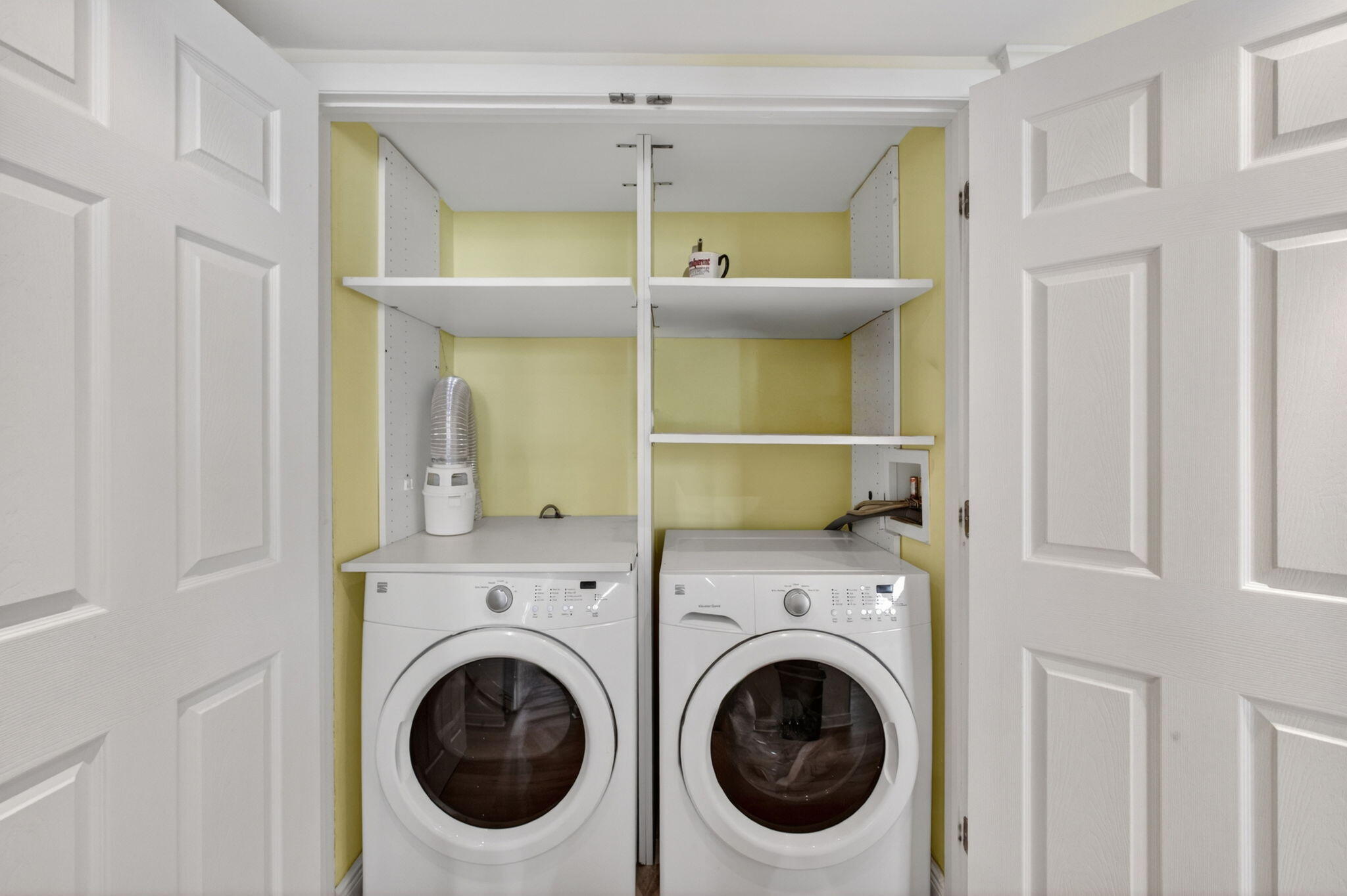 5440 North Ocean Drive, Unit 1006 Riviera Beach, FL 33404 - Photo 36 of 57 a view of a room that has a washer and dryer