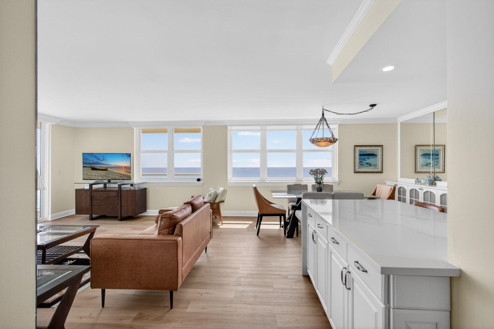 5440 North Ocean Drive, Unit 1006 Riviera Beach, FL 33404 - Photo 6 of 57 a living room with furniture and a table