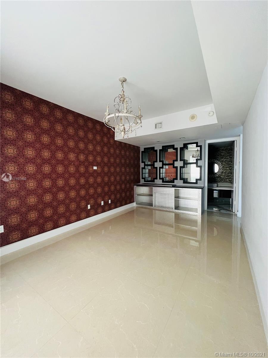 1100 Biscayne Boulevard, Unit 4504 Miami, FL 33132 - Photo 14 of 21 a view of livingroom with furniture and cabinet