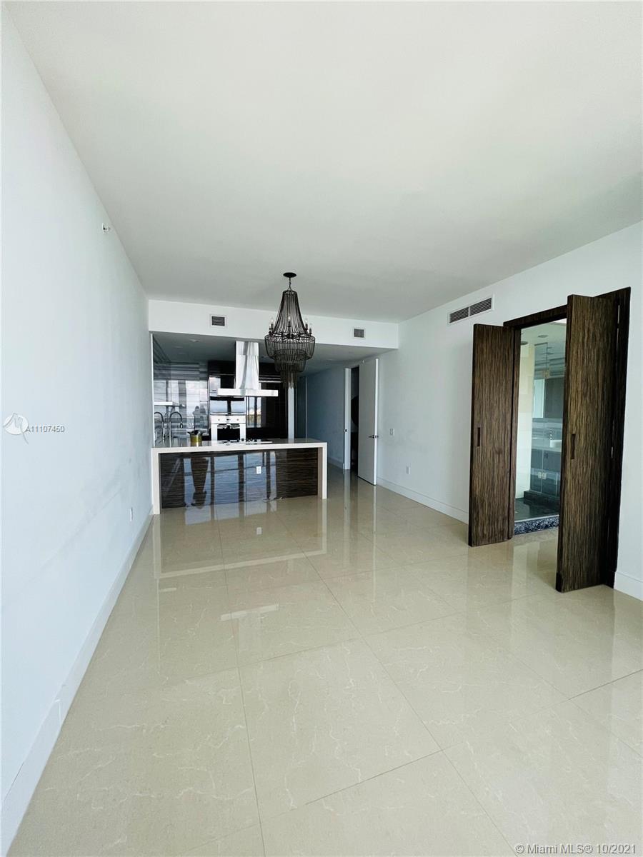 1100 Biscayne Boulevard, Unit 4504 Miami, FL 33132 - Photo 3 of 21 a view of a livingroom with furniture and window